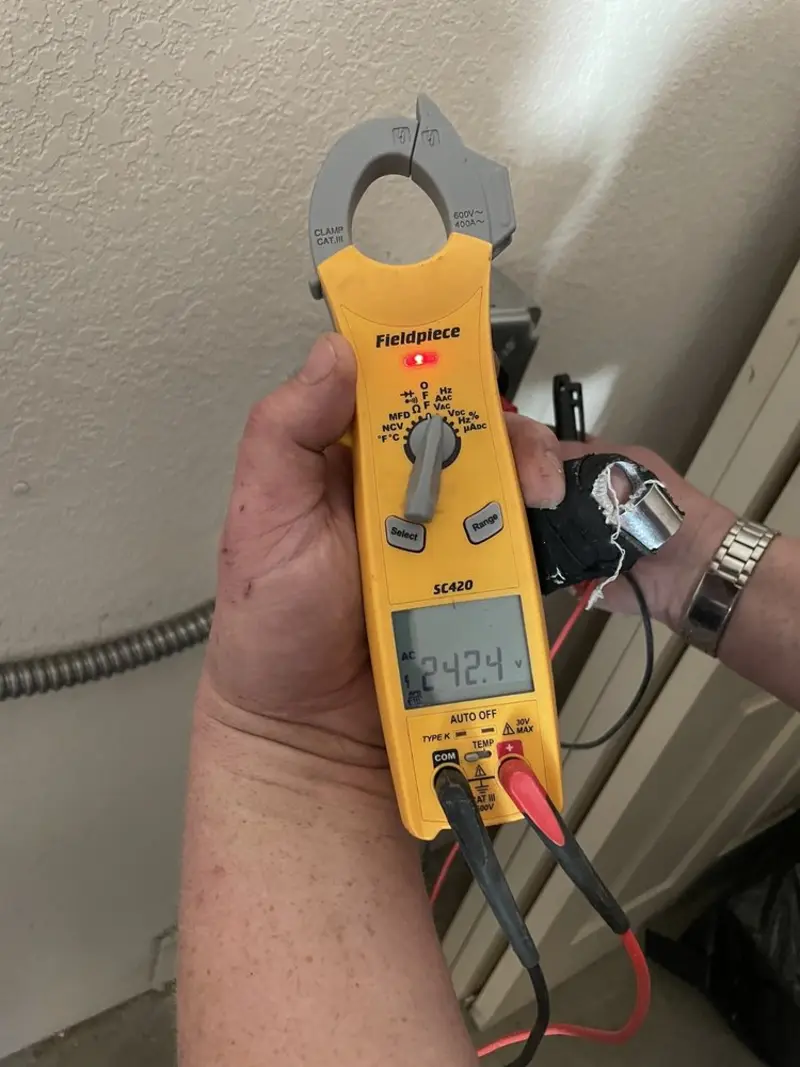 Voltage testing with clamp meter during Circuit Breaker Repair in Fort McKinley
